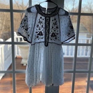 White Zara dress with black flowers and trim